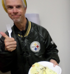 Chris gives a thumbs up for the omelet he made.