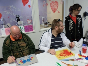 Vincent, Mike, and Hannah during an art activity.