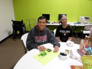 Jose and Chris cut up vegetables for their bean dip.